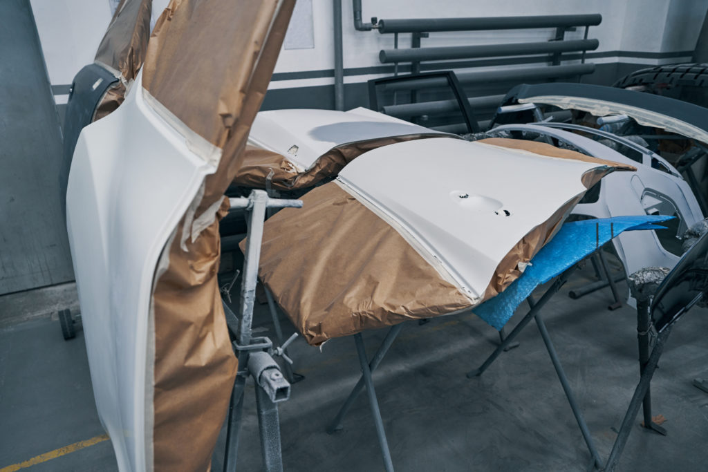 white car components getting ready for paintwork